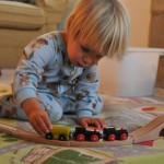 Boys play with trains