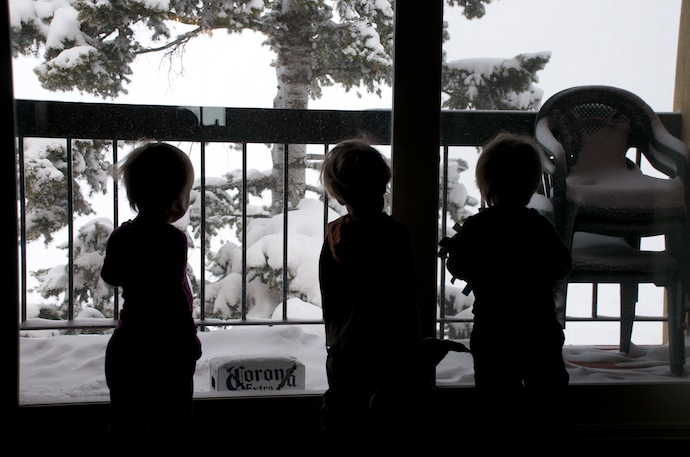 Standing at the window wishing Next year you'll get to go, kiddies