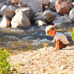 Tory collects rocks for chucking.