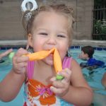 Tegan and a chewtoy at the pool Tegan at the pool with GP (Grandma Pat)