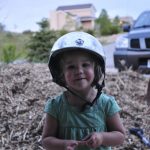 Tegan with mommy's helmet.
