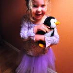 A penguin and a purple skirt.