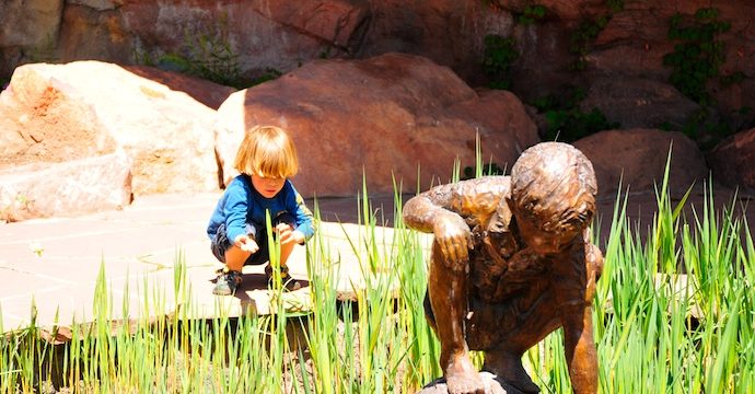 Tory kneels down in Red Butte Garden