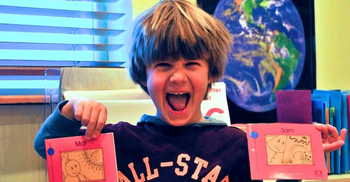 Forced smile aside, I think he's pretty happy about these books.